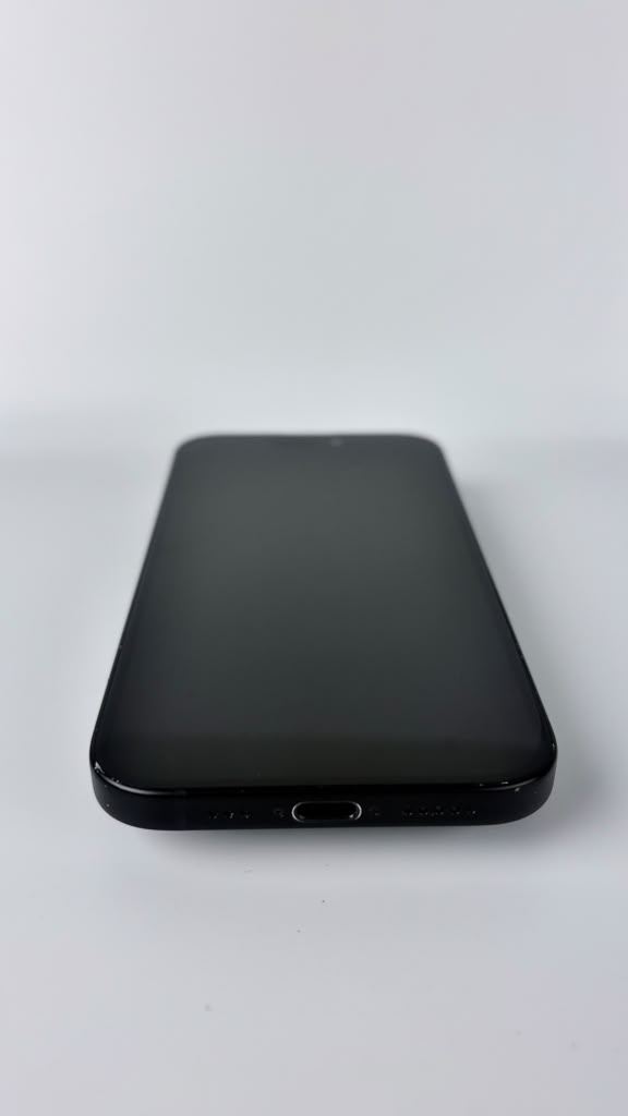 iPhone 15 in Black, front and bottom edge